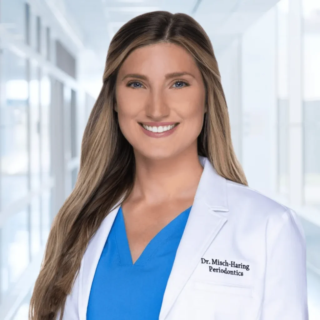 Headshot of Dr. Maggie Misch-Haring, Oral & Maxillofacial Surgeon, wearing a white lab coat.